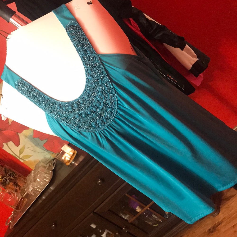 Teal beaded tank top.